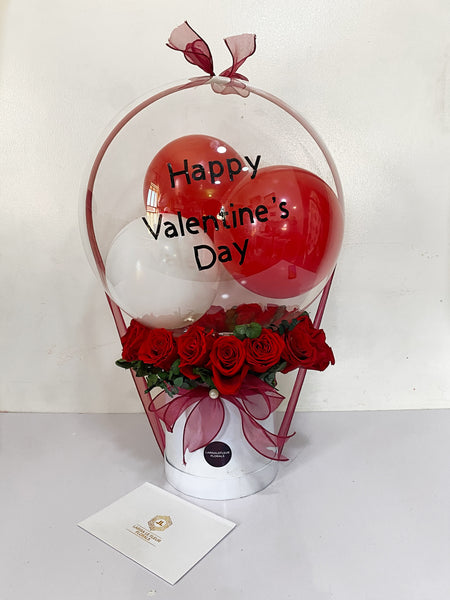 BOX OF ROSES AND A BALLON