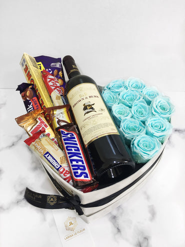 11 ROSES IN A LOVE SHAPED LARGE BOX, MIXED CHOCOLATES AND RED WINE